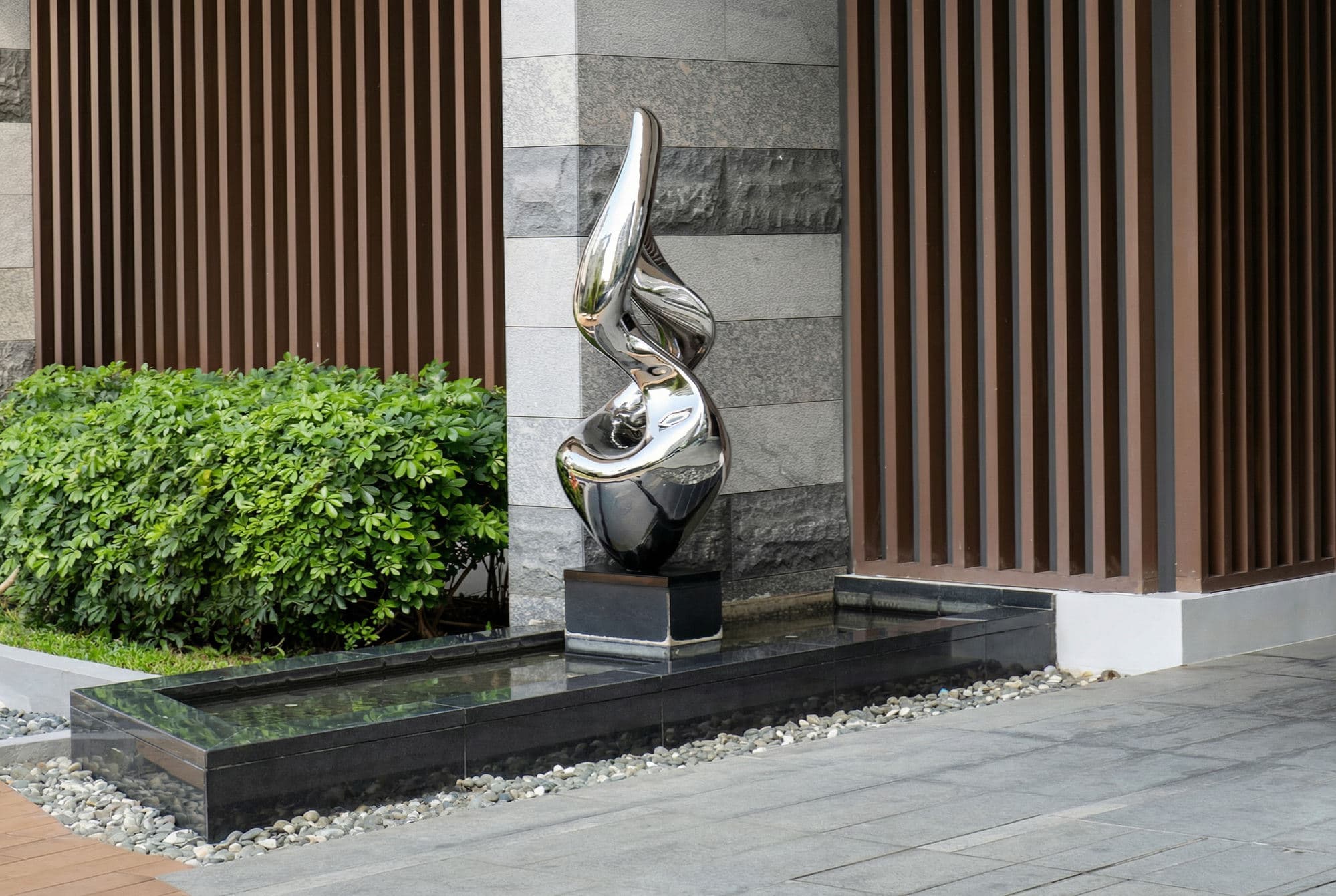 A commissioned stainless steel sculpture at a building entrance