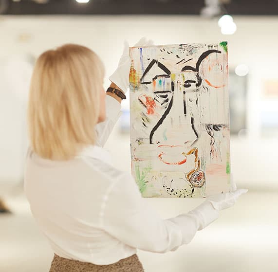 A painting being examined for valuation