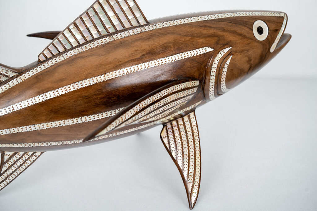 Broken wooden fish after restoration