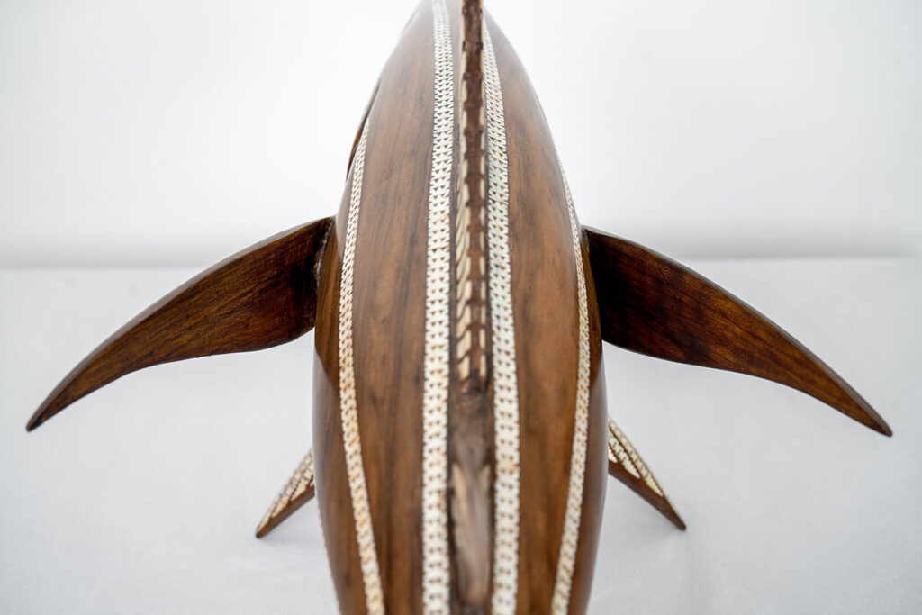 Broken wooden fish after restoration