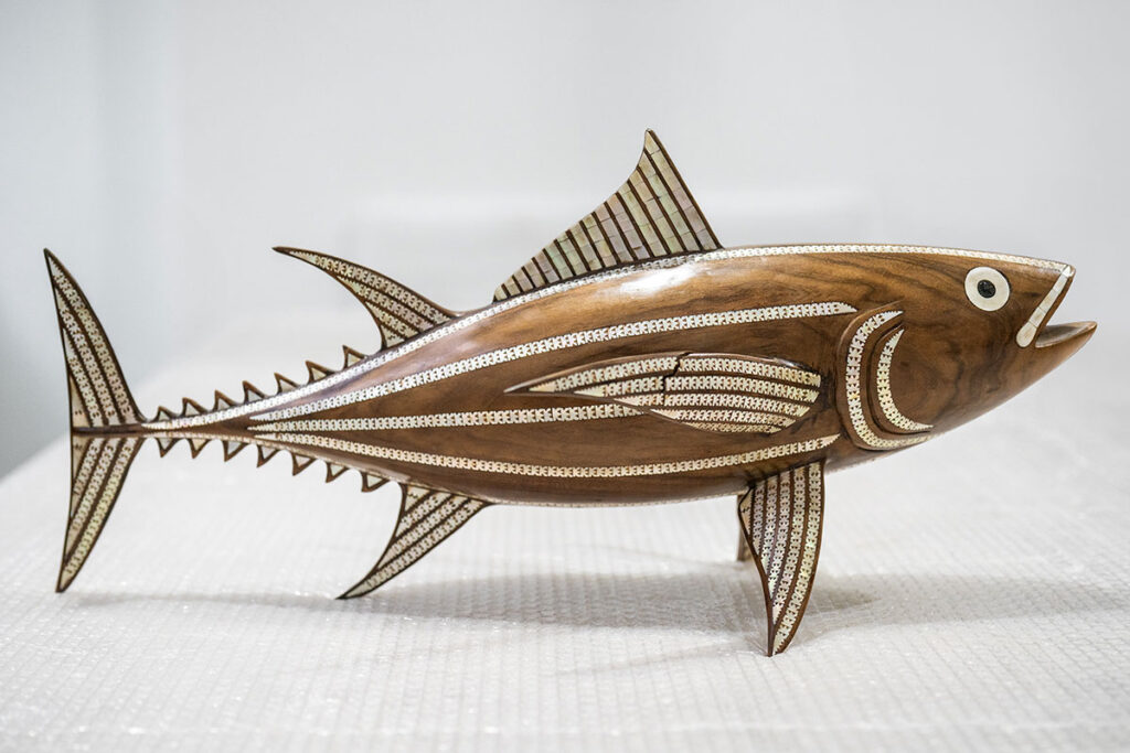 Broken wooden fish before repair