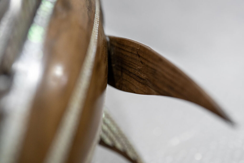Broken wooden fish before repair